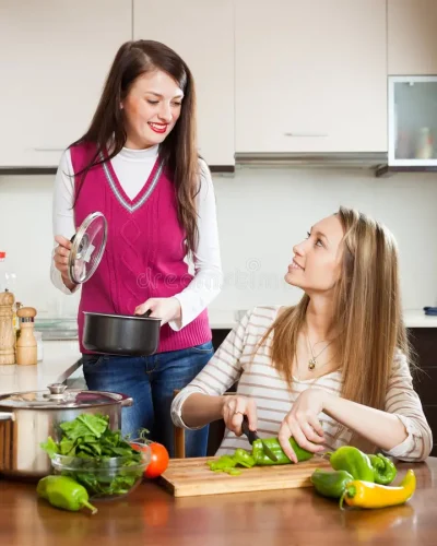 happy-ordinary-women-cooking-food-kitchen-home-40655295